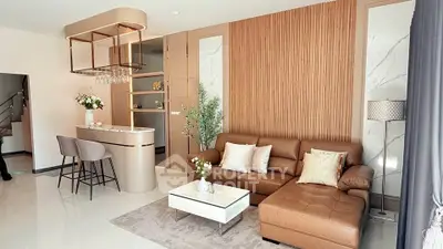 Luxurious modern living room with elegant decor and open kitchen layout