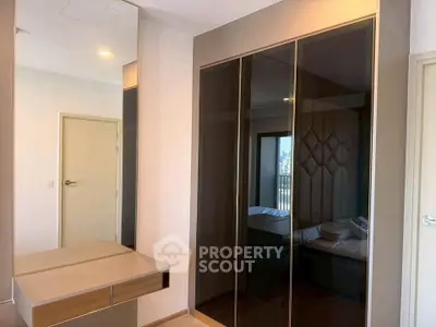 Modern bedroom with sleek wardrobe and stylish decor