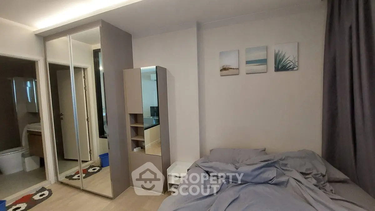 Cozy bedroom with mirrored closet and modern decor