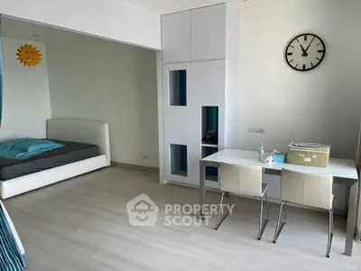 Modern studio apartment with minimalist design and functional furniture