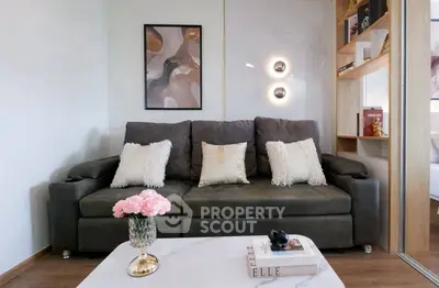 Stylish living room with modern decor and cozy sofa, perfect for relaxation.