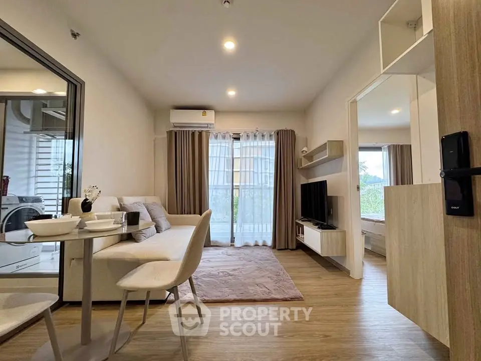 Modern living room with open layout and stylish decor in a contemporary apartment.