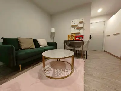 Modern living room with stylish green sofa and elegant decor