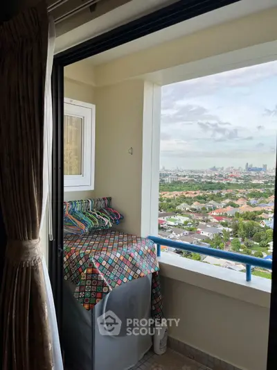 Charming balcony with city view, perfect for relaxation and enjoying the skyline.