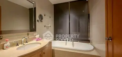 Elegant bathroom with modern fixtures and a luxurious bathtub