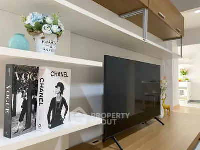 Modern living room with stylish decor and sleek TV setup