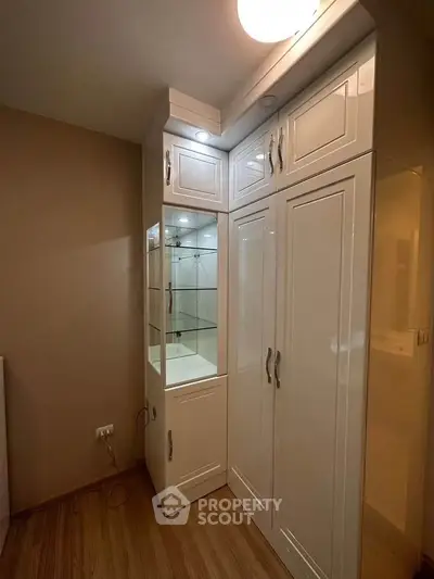 Modern storage cabinet with sleek design and ample space in a cozy room.
