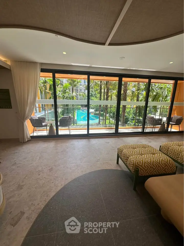 Luxurious living room with pool view and elegant decor