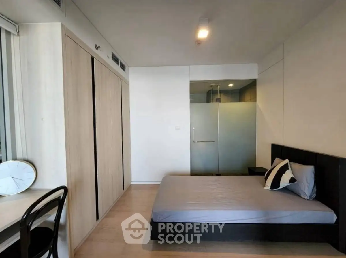 Modern bedroom with minimalist design and built-in wardrobe