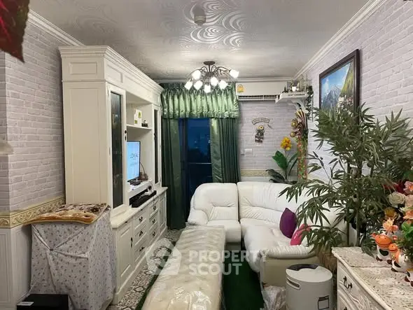 Charming living room with elegant decor and cozy seating, perfect for relaxation and entertainment.