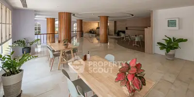 Spacious modern living area with elegant decor and natural light