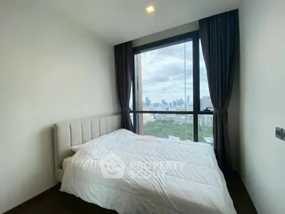 Modern bedroom with stunning city view from large window