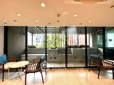 Modern balcony with stylish seating and city view, perfect for relaxation and entertaining.