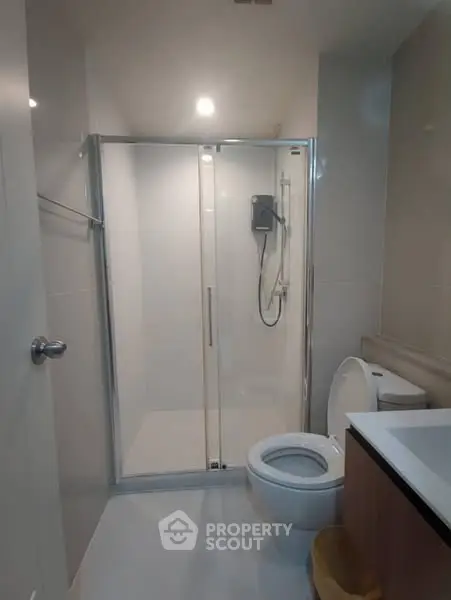 Modern bathroom with glass shower and sleek fixtures