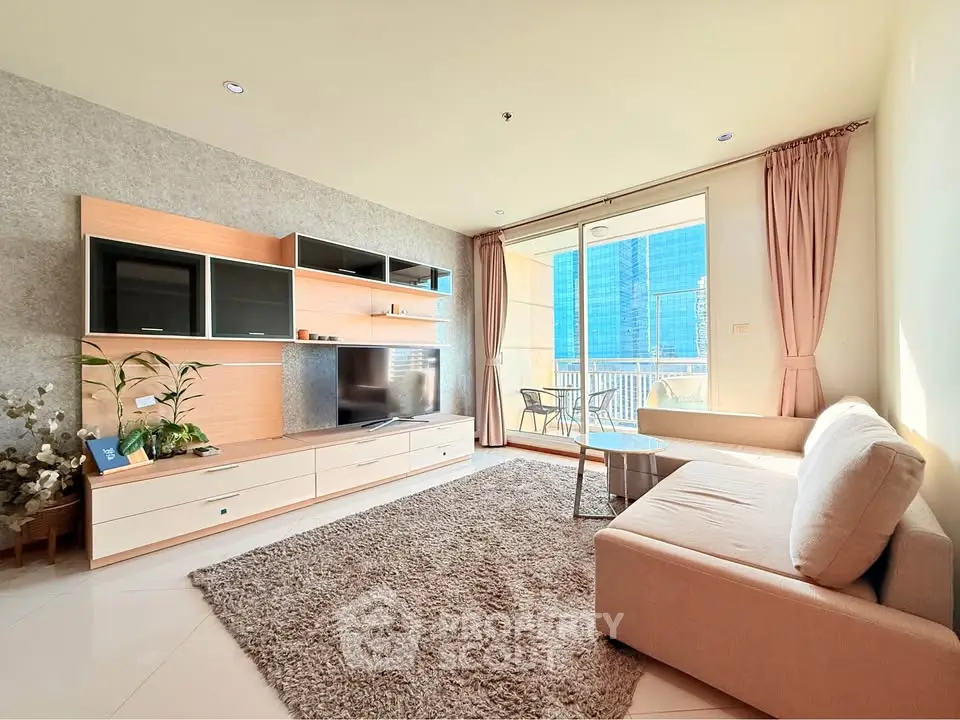 Spacious living room with modern decor and balcony view in luxury apartment.