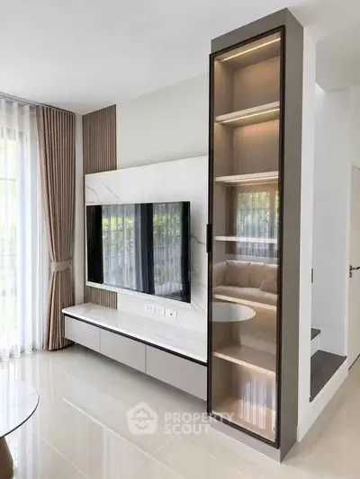 Modern living room with sleek TV setup and elegant shelving unit