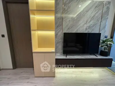 Modern living room with stylish TV unit and elegant lighting