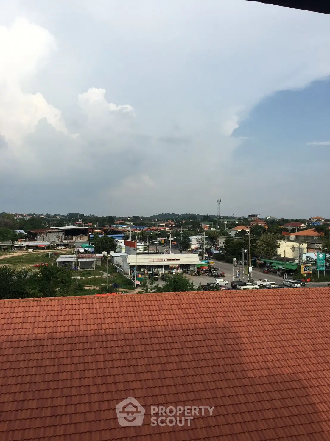 Scenic view from rooftop showcasing urban landscape and distant horizon.