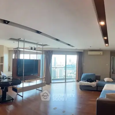 Spacious modern living room with city view and stylish decor