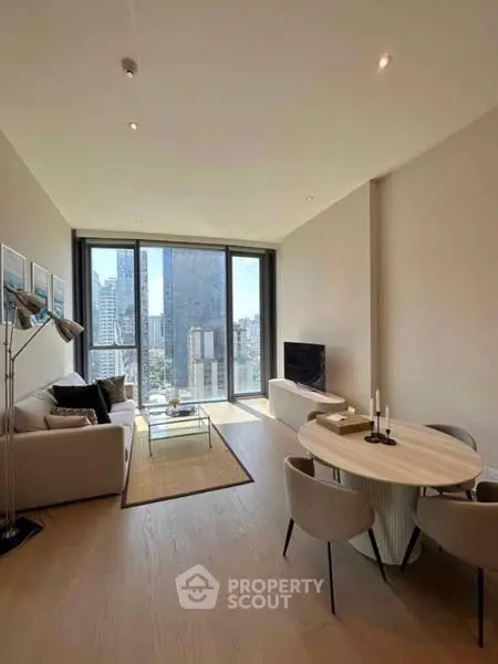 Modern living room with city view, stylish furniture, and natural light