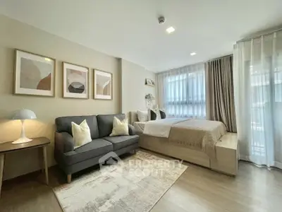 Modern studio apartment with cozy living area and stylish decor