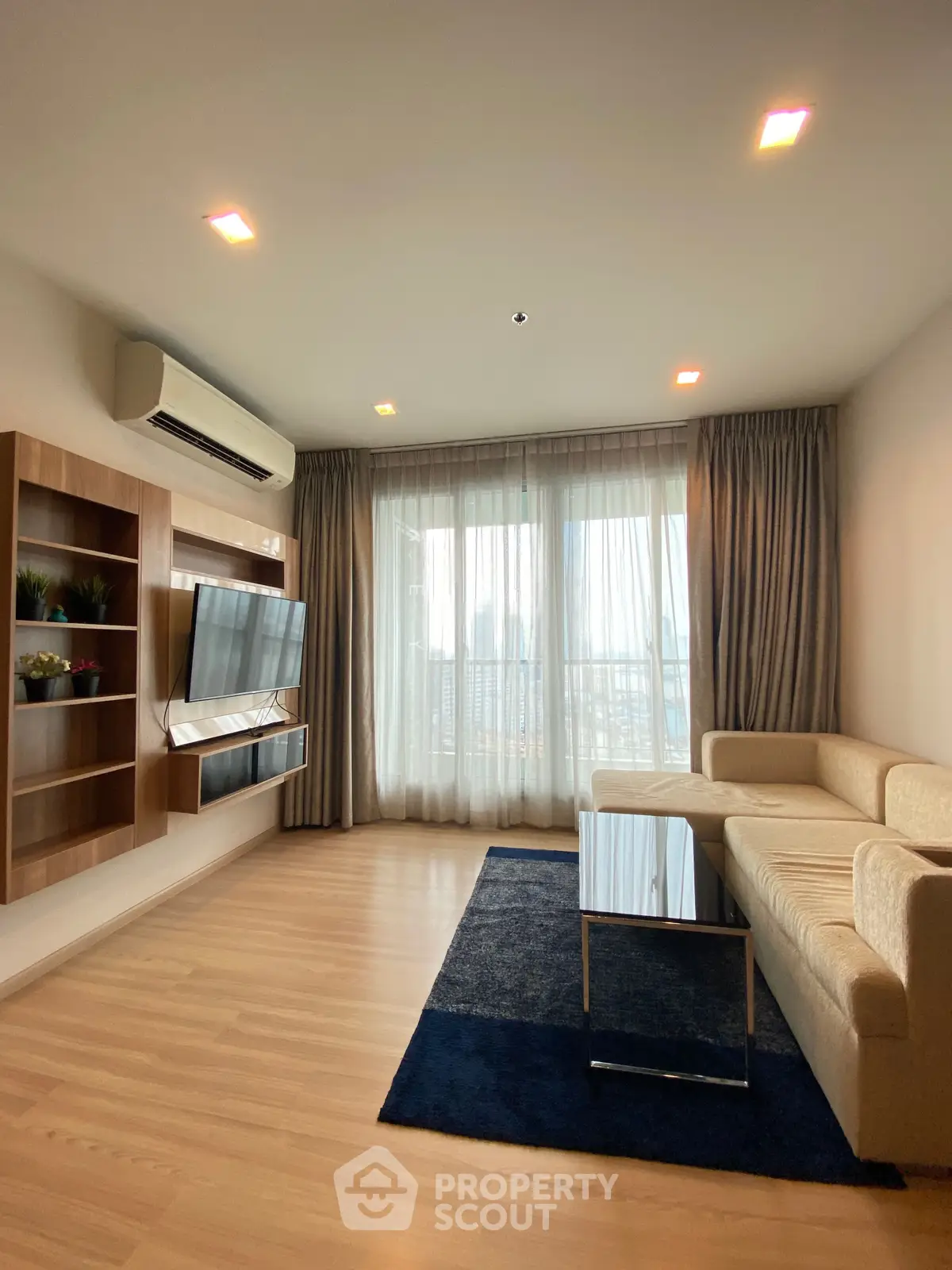 Spacious modern living room with elegant decor and natural light