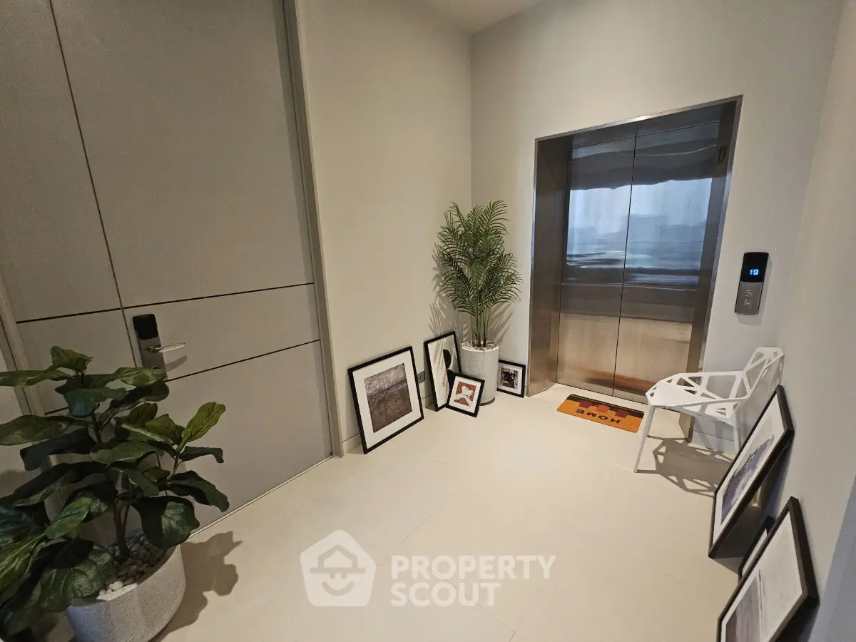 Modern apartment entrance with elevator and stylish decor