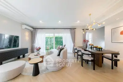Luxurious modern living room with elegant decor and spacious dining area