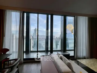 Luxurious living room with floor-to-ceiling windows offering stunning city views in a modern high-rise apartment.