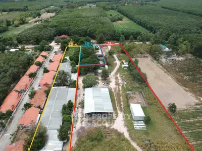 Expansive aerial view of rural property with outlined boundaries and lush greenery.