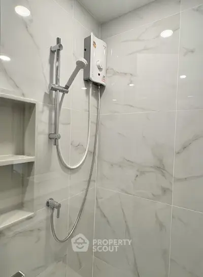 Modern bathroom with sleek shower and marble tiles