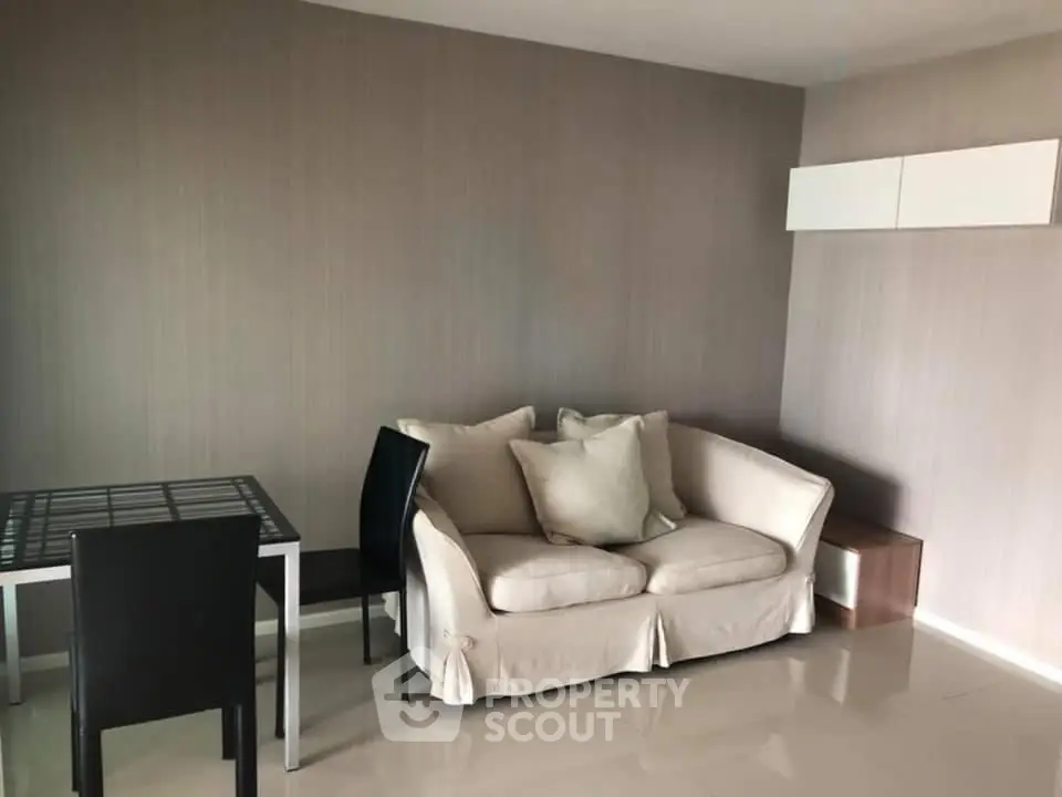 Modern living room with cozy sofa and dining table in a stylish apartment.