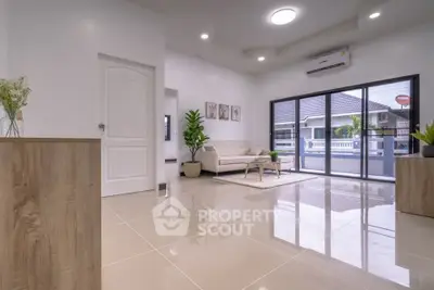 Spacious modern living room with large windows and stylish decor