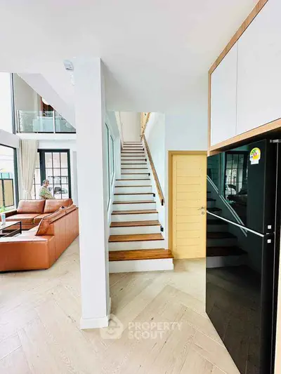 Modern duplex interior with stylish staircase and spacious living area