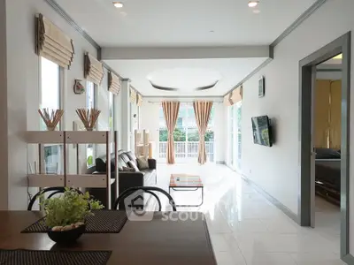 Spacious modern living room with natural light and stylish decor