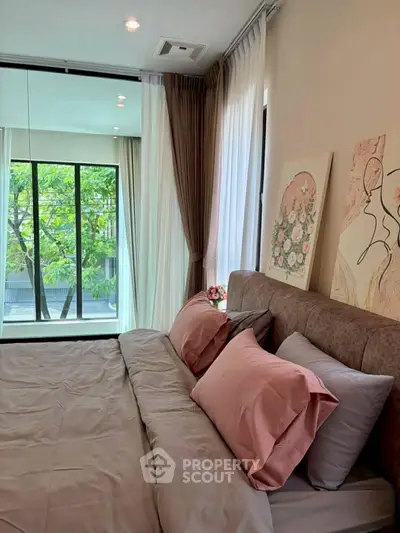 Luxurious bedroom with large windows and elegant decor