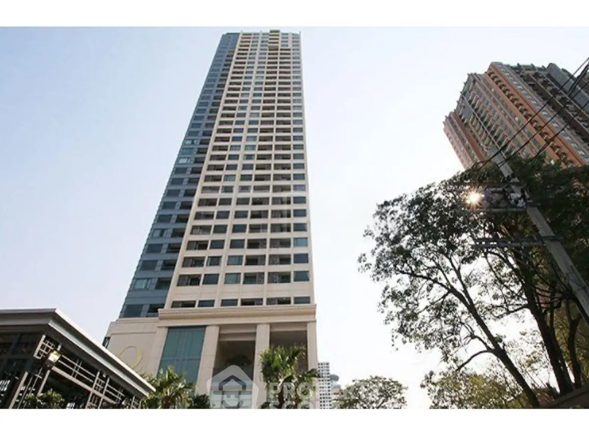 Stunning high-rise building with modern architecture and lush surroundings in a prime urban location.