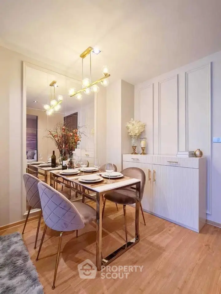 Elegant dining area with modern decor and luxurious lighting in a stylish apartment.