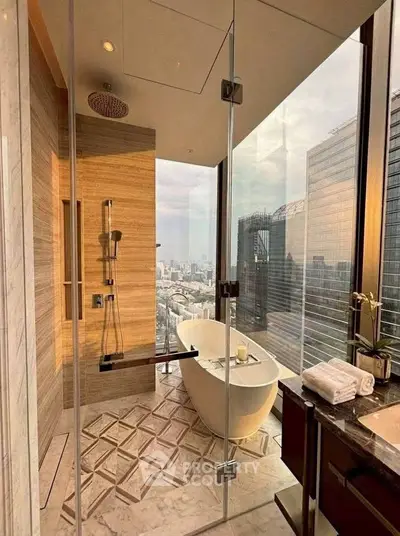 Luxurious bathroom with city view, featuring a freestanding bathtub and modern shower in a high-rise apartment.