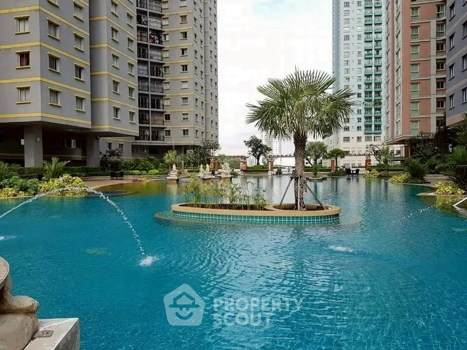 Luxurious residential complex with stunning pool and modern high-rise buildings.