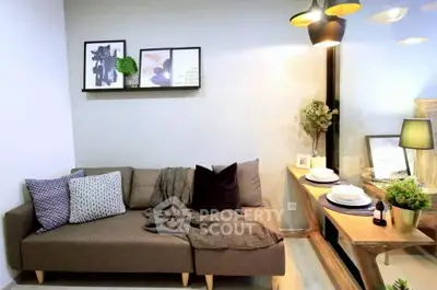 Stylish living room with cozy sofa and elegant dining area, perfect for modern urban living.