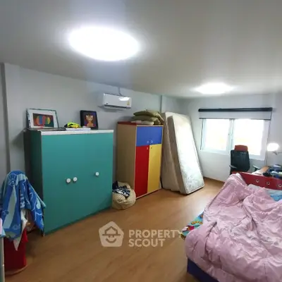 Cozy bedroom with colorful furniture and natural light