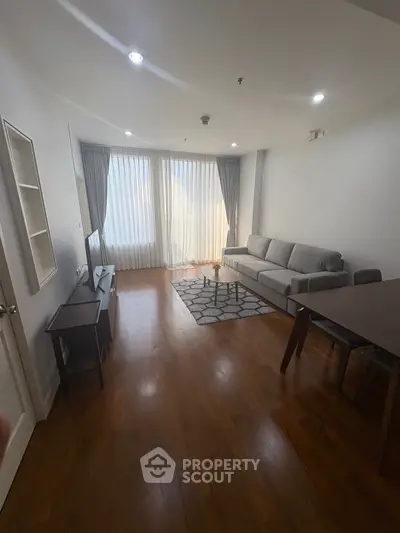 Spacious living room with modern furniture and natural light