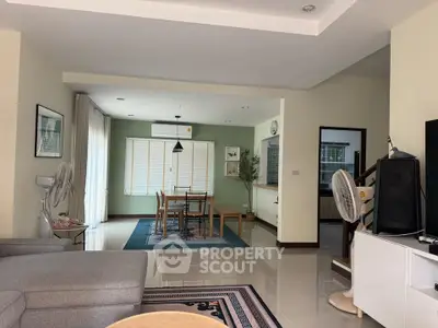 Spacious living room with modern decor and natural light