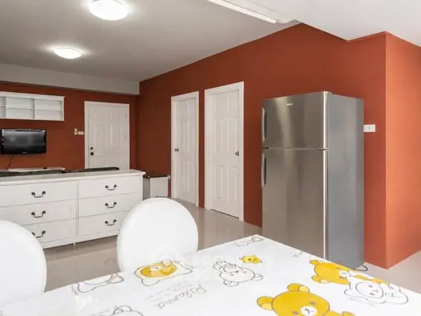 Charming interior with vibrant walls and modern appliances, perfect for cozy living.