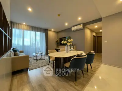 Modern living room with elegant dining area and stylish decor