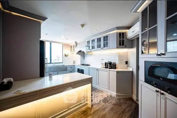 Luxurious modern kitchen with sleek cabinetry and state-of-the-art appliances, perfect for culinary enthusiasts.
