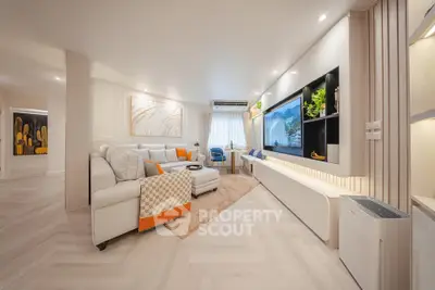 Luxurious modern living room with elegant decor and spacious layout, featuring stylish furniture and ambient lighting.