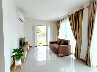 Bright and airy living room with modern decor and large windows offering natural light.