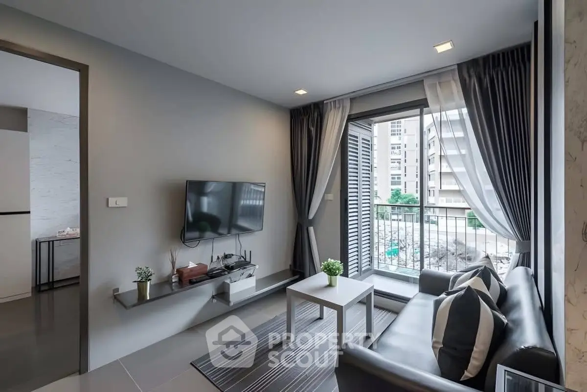 Modern living room with sleek design and balcony view in urban apartment